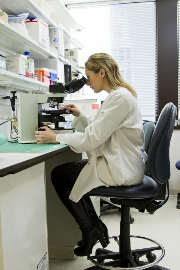 Pharmacist working in a sterile cleanroom environment compliant with USP 797 and USP 800 compounding standards